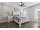 Relaxing bedroom with a ceiling fan and a bed featuring a striped comforter at 119 Sunset Dr., Murrells Inlet, SC 29576