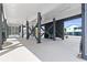 Open space beneath the raised house, showing support beams, a concrete floor, and a glimpse of nearby foliage at 119 Sunset Dr., Murrells Inlet, SC 29576