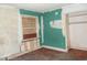 View of a bedroom with peeling paint, boarded window, and visible wear at 12 E Sassafras St., Andrews, SC 29510