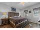 Comfortable bedroom featuring hardwood floors, a ceiling fan, and a rustic wood bed frame at 1221 Tidewater Dr. # 321, North Myrtle Beach, SC 29582