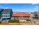 Exterior of a beachfront restaurant, showcasing a covered outdoor deck and beautiful coastal views with a bright blue sky at 1221 Tidewater Dr. # 321, North Myrtle Beach, SC 29582