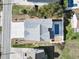 Overhead view of a modern home featuring a pool, driveway, landscaped yard, and dark roof shingles at 128 Seabreeze Dr., Murrells Inlet, SC 29576