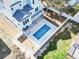 A private rectangular pool in the backyard of a two-story house with a fence at 128 Seabreeze Dr., Murrells Inlet, SC 29576