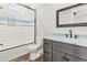 Modern bathroom featuring a glass-enclosed shower, marble countertop, and sleek fixtures at 128 Seabreeze Dr., Murrells Inlet, SC 29576