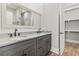 Bathroom featuring a dual sink vanity, granite countertops, and a framed mirror over the sinks at 128 Seabreeze Dr., Murrells Inlet, SC 29576