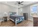 Bedroom with a ceiling fan, two windows, and a blue-and-white furniture set at 128 Seabreeze Dr., Murrells Inlet, SC 29576