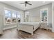 Bedroom with a light color palette and a large window showcasing ocean views at 128 Seabreeze Dr., Murrells Inlet, SC 29576