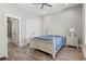 Bedroom featuring a white bed set, two closets and a view into the bathroom at 128 Seabreeze Dr., Murrells Inlet, SC 29576