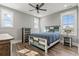 Bedroom featuring a ceiling fan, and a blue-and-white bed set and matching furnishings at 128 Seabreeze Dr., Murrells Inlet, SC 29576