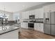 Bright kitchen featuring stainless steel appliances, granite countertops and white cabinets at 128 Seabreeze Dr., Murrells Inlet, SC 29576