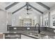 Kitchen with granite countertops, a stainless steel sink, and an open view into the living area at 128 Seabreeze Dr., Murrells Inlet, SC 29576