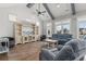 Bright living room with vaulted ceiling, wood floors, and large windows providing ample natural light at 128 Seabreeze Dr., Murrells Inlet, SC 29576