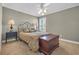 Bedroom featuring carpet, ceiling fan, and accent lamps that provide a warm, inviting atmosphere at 128 Waterway Crossing Ct., Little River, SC 29566