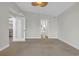 Bedroom showcasing doorway, ceiling fan, and connection to other parts of the home at 128 Waterway Crossing Ct., Little River, SC 29566