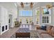 Bright and airy living room boasts soaring ceilings, large windows and doors, and tile floors at 128 Waterway Crossing Ct., Little River, SC 29566