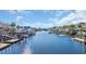 Scenic waterfront community featuring multiple docks, boats, and beautiful blue sky at 128 Waterway Crossing Ct., Little River, SC 29566