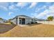 Backyard with a screened-in porch, well-maintained lawn, and stylish exterior of a single-Gathering home at 1317 Captain Hooks Way, North Myrtle Beach, SC 29582