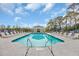 Sparkling community pool with inviting lounge area and shaded cabana, ideal for summer days at 1317 Captain Hooks Way, North Myrtle Beach, SC 29582