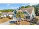 An aerial view of a well-maintained home with a beautiful lawn and mature trees at 132 Summerlight Dr., Murrells Inlet, SC 29576