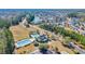 Beautiful aerial view of the community showcasing the pool, clubhouse, and lush landscaping at 132 Summerlight Dr., Murrells Inlet, SC 29576