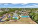 Aerial view of the community's amenities: clubhouse, swimming pools, playground, and sports courts at 132 Summerlight Dr., Murrells Inlet, SC 29576