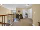 The loft area features a desk, chair, and iron railing overlooking the foyer, leading to additional bedrooms at 132 Summerlight Dr., Murrells Inlet, SC 29576