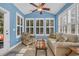 Inviting sunroom with a ceiling fan, plantation shutters, and comfortable seating at 132 Summerlight Dr., Murrells Inlet, SC 29576