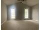 Spacious bedroom with vaulted ceiling, neutral carpeting, and double doors at 1413 Cane St. # 1, North Myrtle Beach, SC 29582