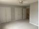 Large bedroom features neutral carpeting, ceiling fan and an attached closet at 1413 Cane St. # 1, North Myrtle Beach, SC 29582