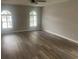 Neutral bedroom with modern floors and a large window at 1413 Cane St. # 1, North Myrtle Beach, SC 29582