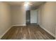 Neutral bedroom with modern floors leading into the bathroom at 1413 Cane St. # 1, North Myrtle Beach, SC 29582