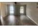 Bright, airy living room with wood-look flooring, and light gray walls at 1413 Cane St. # 1, North Myrtle Beach, SC 29582