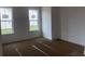 Bright bedroom with two large windows, white walls, and clean trim, ready for personalization at 147 Joyce Dr, Longs, SC 29568