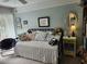 Bright bedroom with a daybed, multiple pillows, colorful furniture, and decor at 14A Salt Marsh Cove # 14A, Pawleys Island, SC 29585