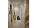 Hallway featuring tiled floors, neutral walls, and white doors at 14A Salt Marsh Cove # 14A, Pawleys Island, SC 29585