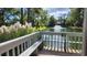 Beautiful view of a pond with fountain, seen from a deck with bench seating at 14A Salt Marsh Cove # 14A, Pawleys Island, SC 29585