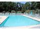 Enjoy the community swimming pool with several lounge chairs for community residents at 14A Salt Marsh Cove # 14A, Pawleys Island, SC 29585