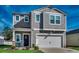 Charming two-story home with gray siding, white trim, and a welcoming front porch at 1527 Swing Bridge Way, Myrtle Beach, SC 29588