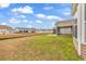 Home with a backyard leading to a body of water, lawns, and covered porches at 1616 Deltura Dr., Myrtle Beach, SC 29588