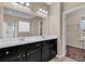 Modern bathroom featuring a dual sink vanity with a granite countertop and dark cabinetry at 1616 Deltura Dr., Myrtle Beach, SC 29588