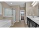 Spacious bathroom with a soaking tub, glass shower, dual sink vanity, and tile flooring at 1616 Deltura Dr., Myrtle Beach, SC 29588