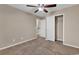 Inviting bedroom featuring plush carpet, a ceiling fan, closet and neutral walls at 1616 Deltura Dr., Myrtle Beach, SC 29588