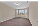 Cozy bedroom with neutral walls, carpeted floors, and a bay window offering natural light at 1616 Deltura Dr., Myrtle Beach, SC 29588