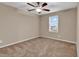 Comfortable carpeted bedroom featuring a ceiling fan and natural light from the window at 1616 Deltura Dr., Myrtle Beach, SC 29588