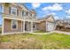 Eye-level of a tan home with an attached two-car garage and a manicured lawn on a sunny day at 1616 Deltura Dr., Myrtle Beach, SC 29588