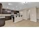 Well-lit kitchen with dark wood cabinets, stainless steel appliances, and a central island with bar seating at 1616 Deltura Dr., Myrtle Beach, SC 29588