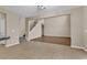 Open living room with hardwood floors, a staircase, and views into the kitchen area at 1616 Deltura Dr., Myrtle Beach, SC 29588