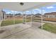 Relaxing screened-in porch with a concrete floor overlooking the backyard and waterway at 1616 Deltura Dr., Myrtle Beach, SC 29588