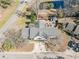 Overhead view of the property showing backyard, patio, pond, and surrounding neighborhood at 17 Racquet Club Dr., Pawleys Island, SC 29585