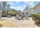 Spacious brick patio with multiple seating areas perfect for outdoor entertaining at 17 Racquet Club Dr., Pawleys Island, SC 29585